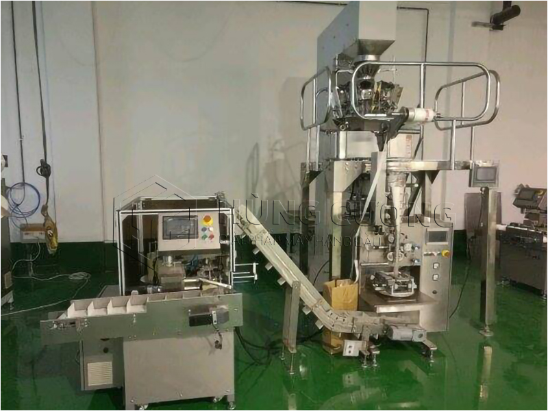 3. To-hop-may-dong-goi-tra-tui-tam-giac-dxdc50b-can-dinh-luong